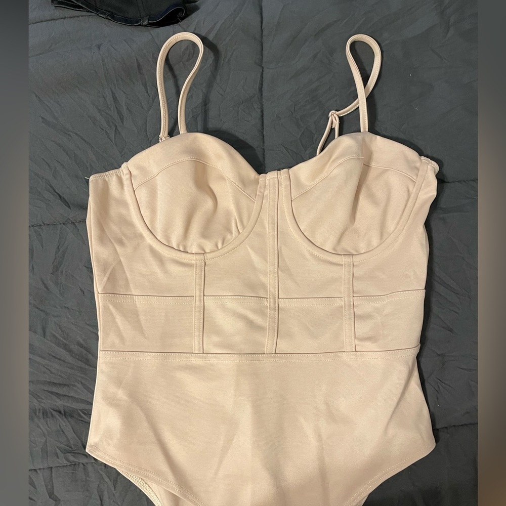 Tan body suit